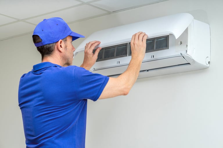 HVAC technician performing air conditioner maintenance inspection